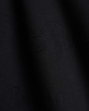 Premium black Kids Cedrick All Over Jacquard Crew featuring a refined, tonal all-over jacquard knit pattern of the iconic Psycho Bunny skull logo for subtle branding.