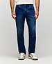 Mens Ace Knit Denim Pant in dark blue knit denim with subtle fading, a classic fit, and a small orange Psycho Bunny tag on the coin pocket.