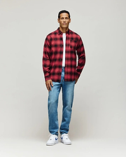 Red and black plaid flannel shirt with subtle all-over Psycho Bunny skull pattern, classic fit, layered over a white jersey t-shirt, paired with light wash Mens Emerson Denim Pant.