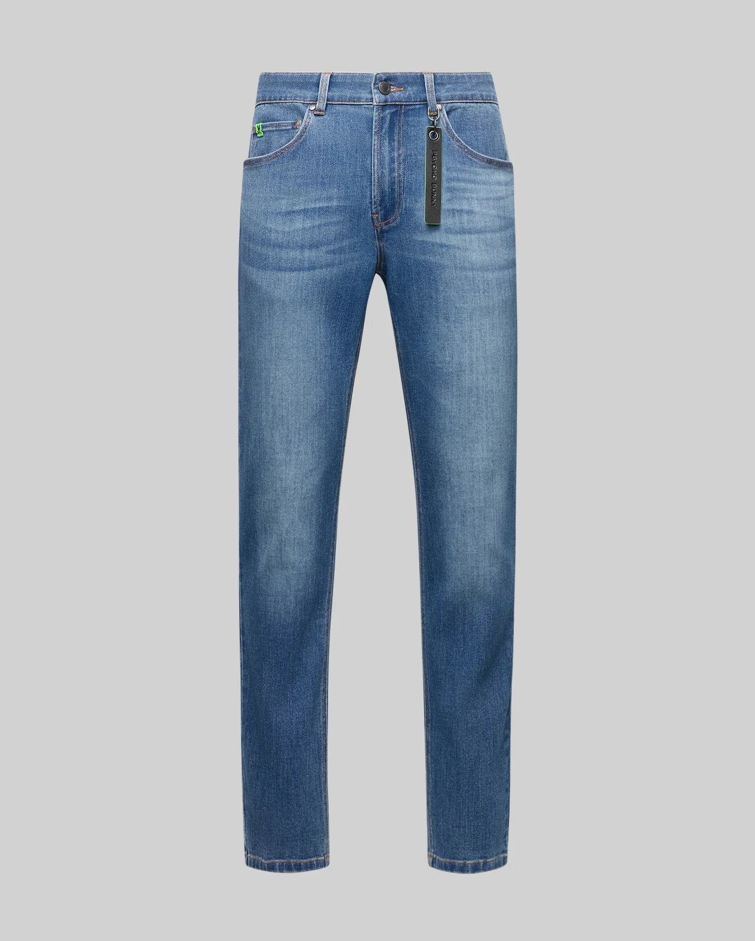 Mens Emerson Denim Pant, classic fit blue faded denim jeans with a small embroidered green bunny skull logo on the coin pocket and a black Psycho Bunny keychain.