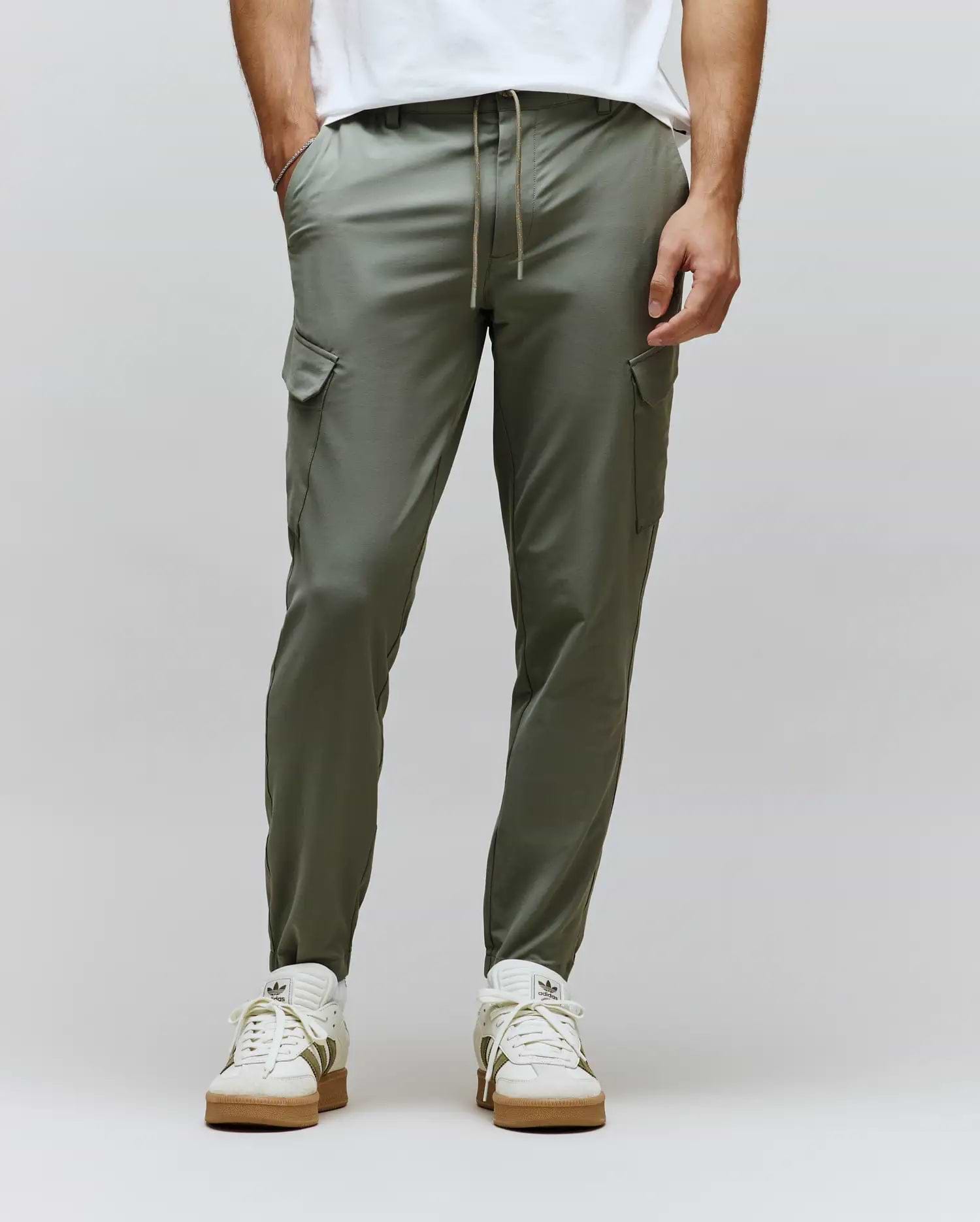 Mens Luka Cargo Pant in a modern slim fit, crafted from smooth olive green fabric, featuring practical side cargo pockets and an adjustable brown drawstring waist.