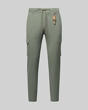 Mens Luka Cargo Pant in sage green, featuring a relaxed fit, smooth fabric, side cargo pockets, an orange drawstring, and a distinctive orange Psycho Bunny skull keychain.