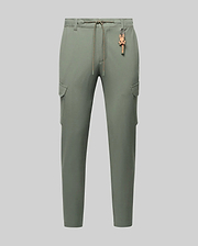 Mens Luka Cargo Pant in sage green, featuring a relaxed fit, smooth fabric, side cargo pockets, an orange drawstring, and a distinctive orange Psycho Bunny skull keychain.