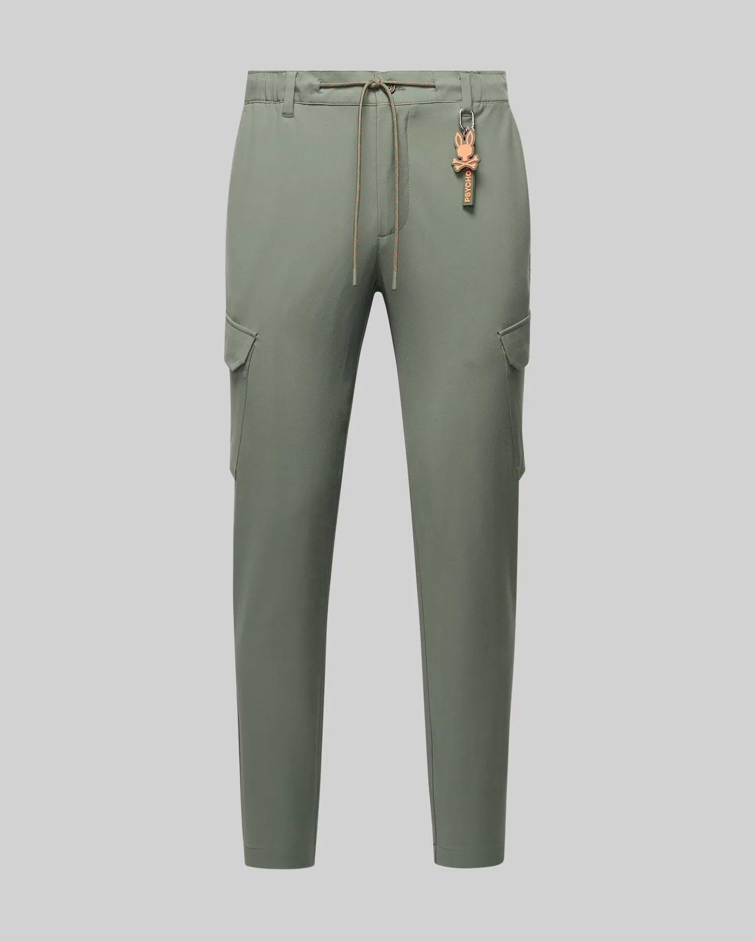 Mens Luka Cargo Pant in sage green, featuring a relaxed fit, smooth fabric, side cargo pockets, an orange drawstring, and a distinctive orange Psycho Bunny skull keychain.