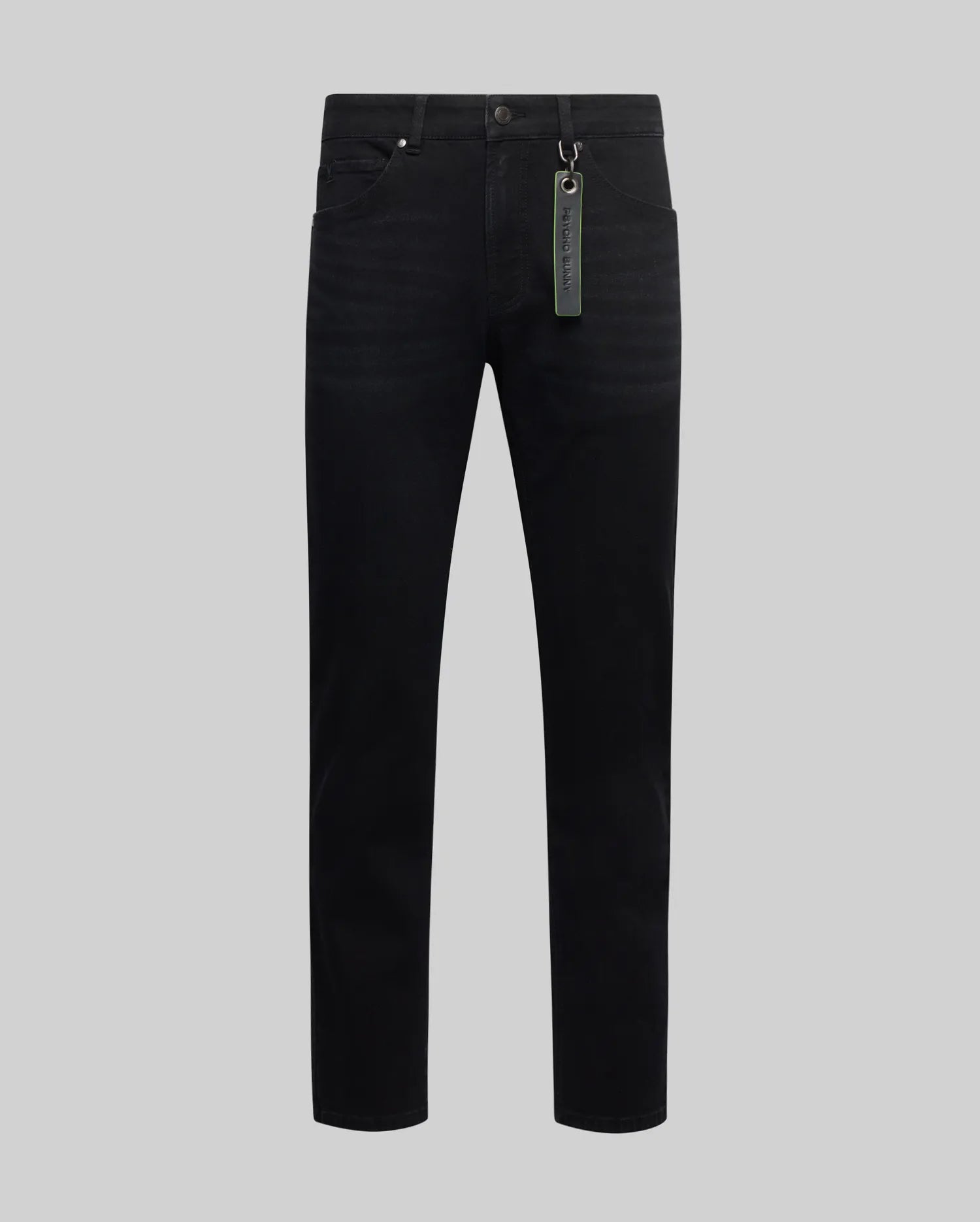 Mens Emerson Denim Pant, premium black slim-fit denim with a subtle faded wash and classic five-pocket styling, accented by a vibrant green Psycho Bunny branded keychain tag on the front belt loop.