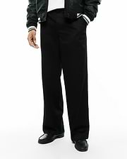 Mens Aidan Chino Pant, a sleek black premium menswear piece, featuring a relaxed, wide-leg fit and smooth, durable chino fabric, ideal for modern streetwear aesthetics. (3)