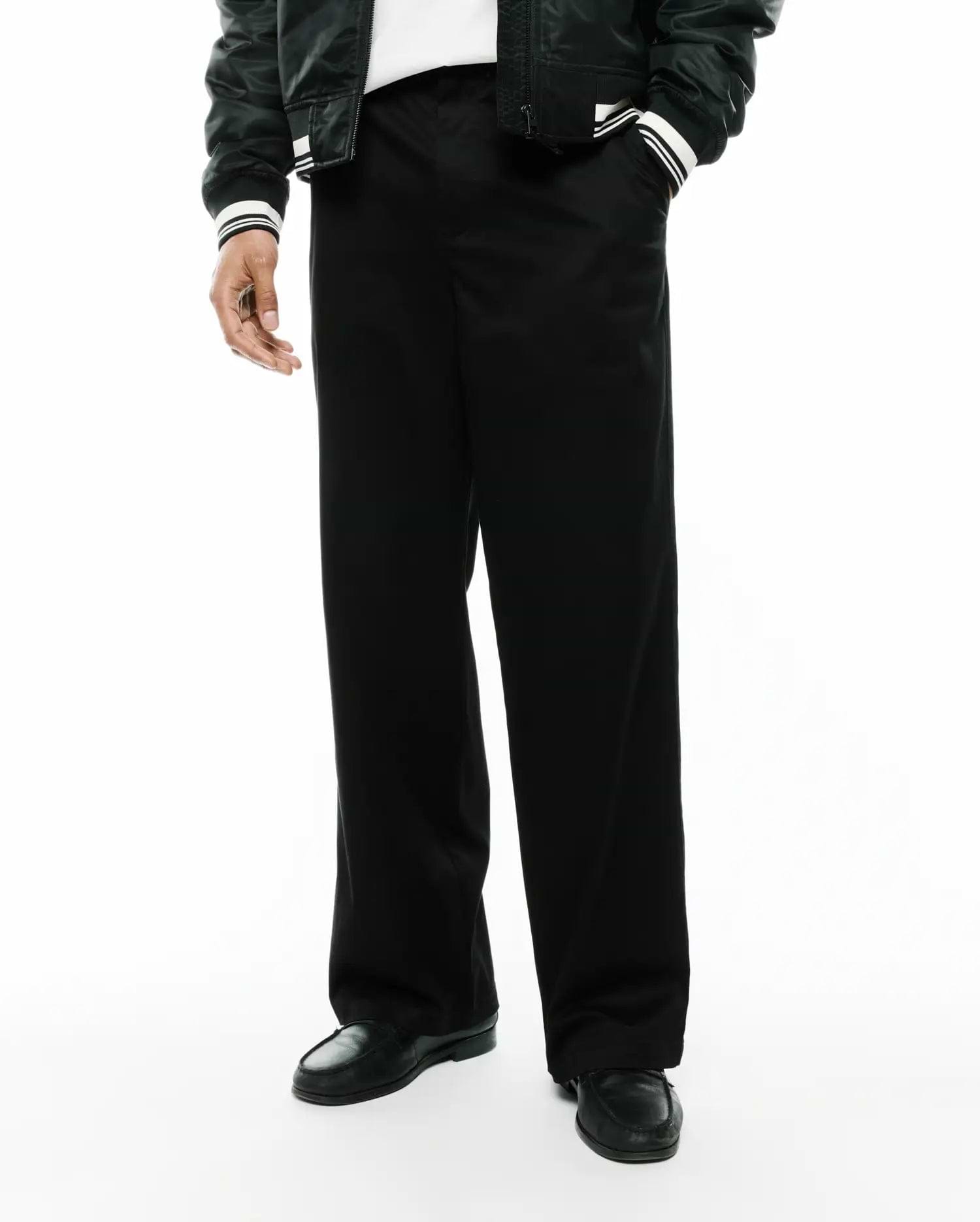 Mens Aidan Chino Pant, a sleek black premium menswear piece, featuring a relaxed, wide-leg fit and smooth, durable chino fabric, ideal for modern streetwear aesthetics. (3)