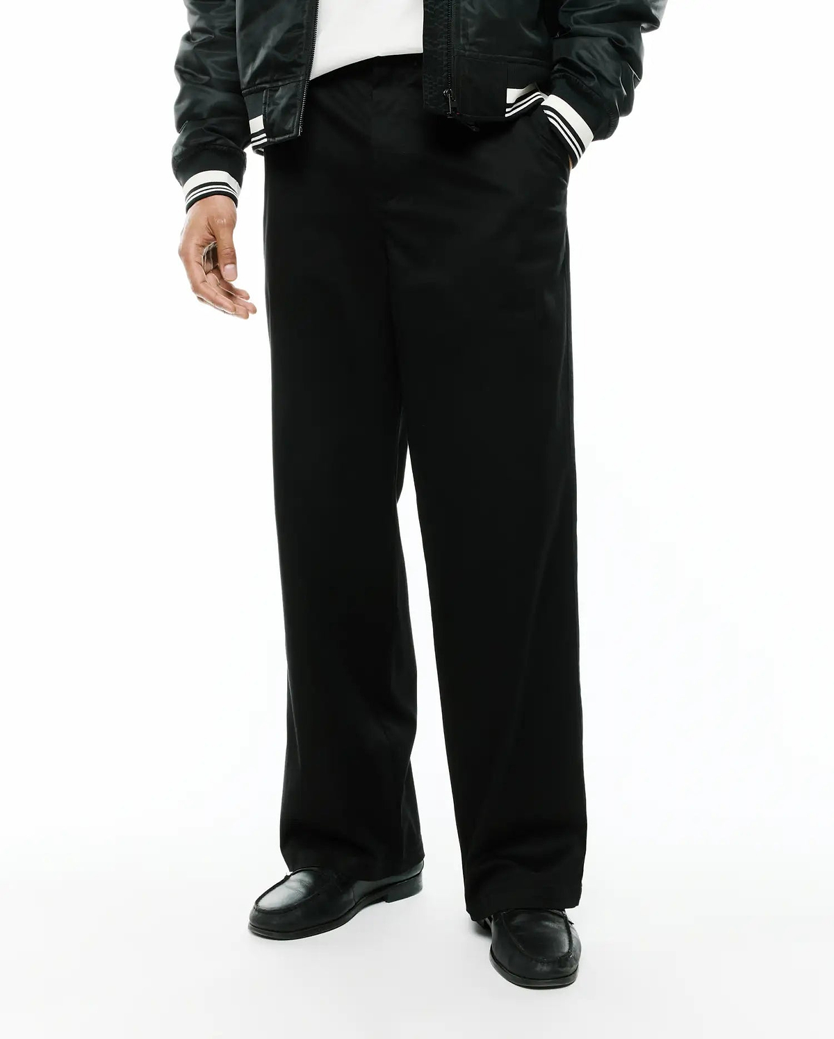 Mens Aidan Chino Pant, a sleek black premium menswear piece, featuring a relaxed, wide-leg fit and smooth, durable chino fabric, ideal for modern streetwear aesthetics. (3)