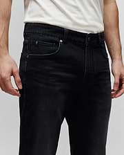 Mens Ace Knit Denim Pant, black knit denim with a classic fit, featuring a small embroidered Psycho Bunny skull logo on the coin pocket and branded metal hardware.