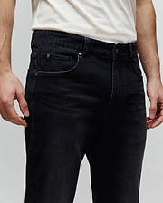 Mens Ace Knit Denim Pant, black knit denim with a classic fit, featuring a small embroidered Psycho Bunny skull logo on the coin pocket and branded metal hardware.