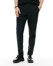 Mens Edward 10k Tapered Pant in dark green, featuring a slim tapered fit and smooth performance fabric, with a small embroidered Psycho Bunny skull logo on the upper right thigh.