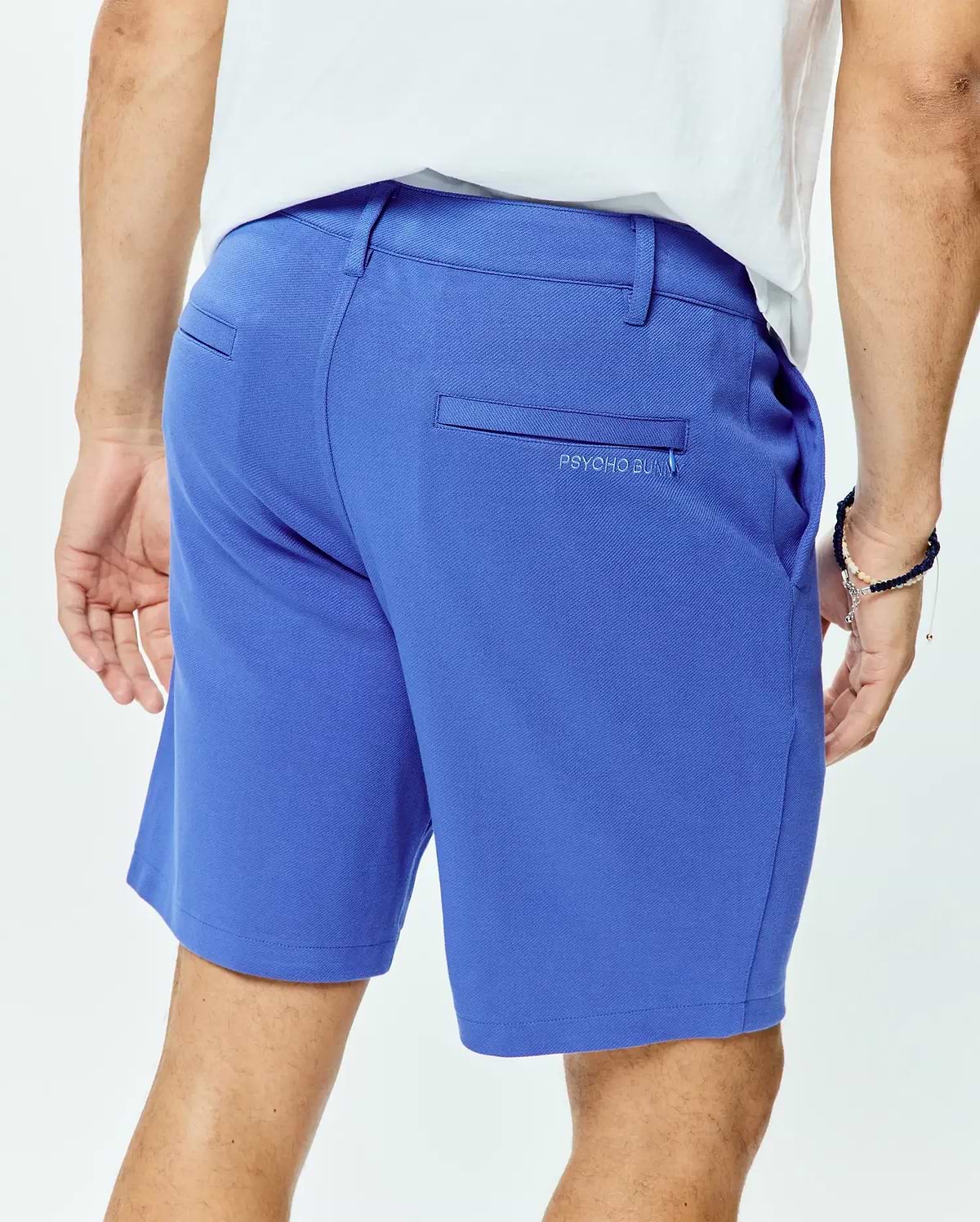 Vibrant blue Mens Shiro Twill Short with a classic fit, featuring smooth twill fabric, rear welt pockets, and a small, tonal embroidered PSYCHO BUNNY logo on the right back pocket.