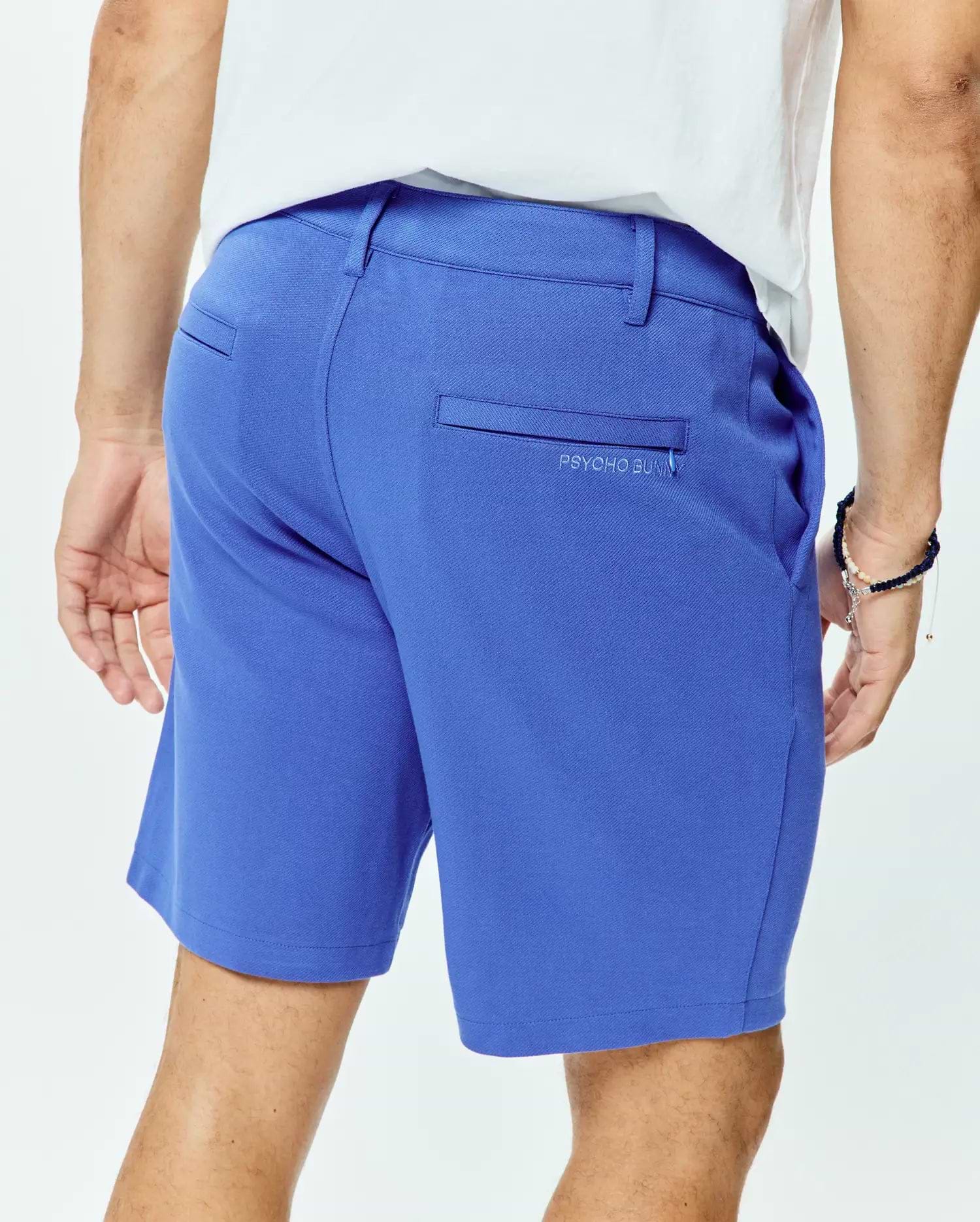 Vibrant blue Mens Shiro Twill Short with a classic fit, featuring smooth twill fabric, rear welt pockets, and a small, tonal embroidered PSYCHO BUNNY logo on the right back pocket.