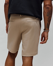Khaki Mens Shiro Twill Short, a classic fit streetwear essential with a visible diagonal twill texture and subtle tonal embroidered Psycho Bunny text logo above the back right welt pocket.