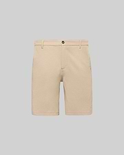Mens Shiro Twill Short in beige, featuring a classic fit, visible twill texture, button closure, and a small embroidered Psycho Bunny skull logo on the lower left leg.