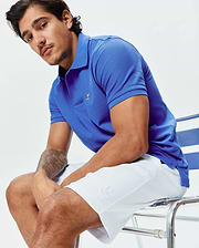 Royal blue pique polo with small embroidered Psycho Bunny skull logo on left chest. White Mens Shiro Twill Short features an embroidered bunny logo on the left thigh.
