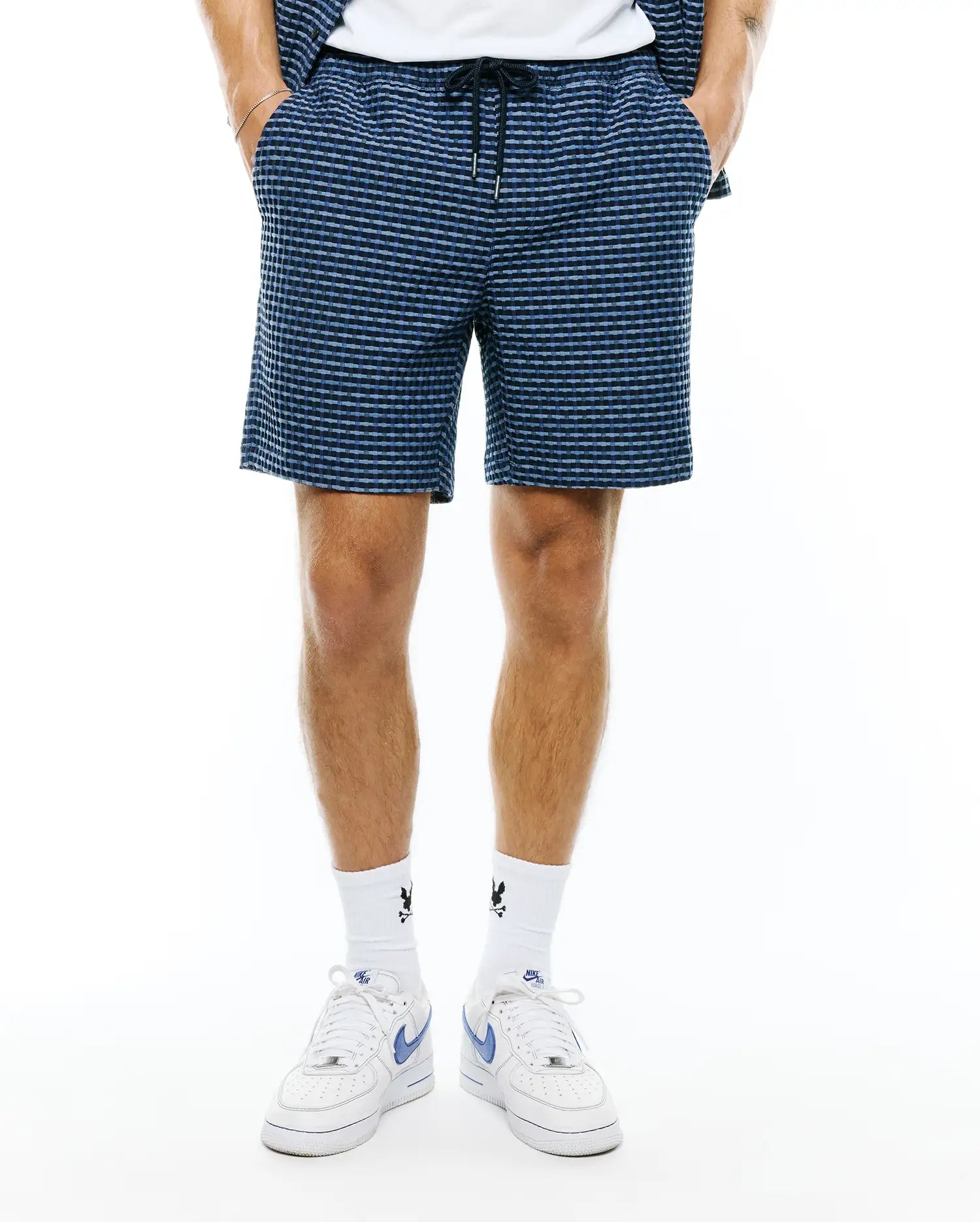 Mens Erik Raised Check Short, a relaxed fit short in dark blue with a lighter blue raised check pattern, featuring a comfortable drawstring waist and side pockets.