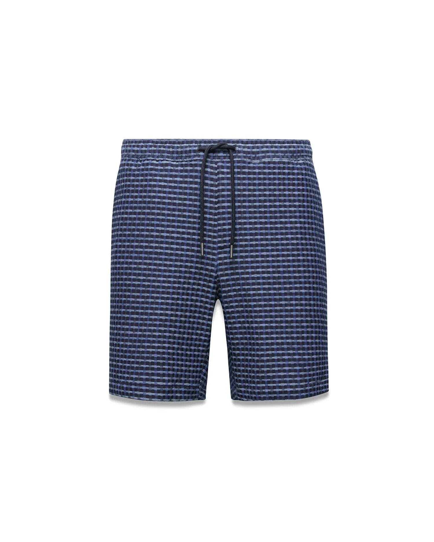 Mens Erik Raised Check Short: Relaxed fit blue and navy textured raised check shorts, showcasing a subtle yet distinct pattern and a functional drawstring waist with metal-tipped cords.