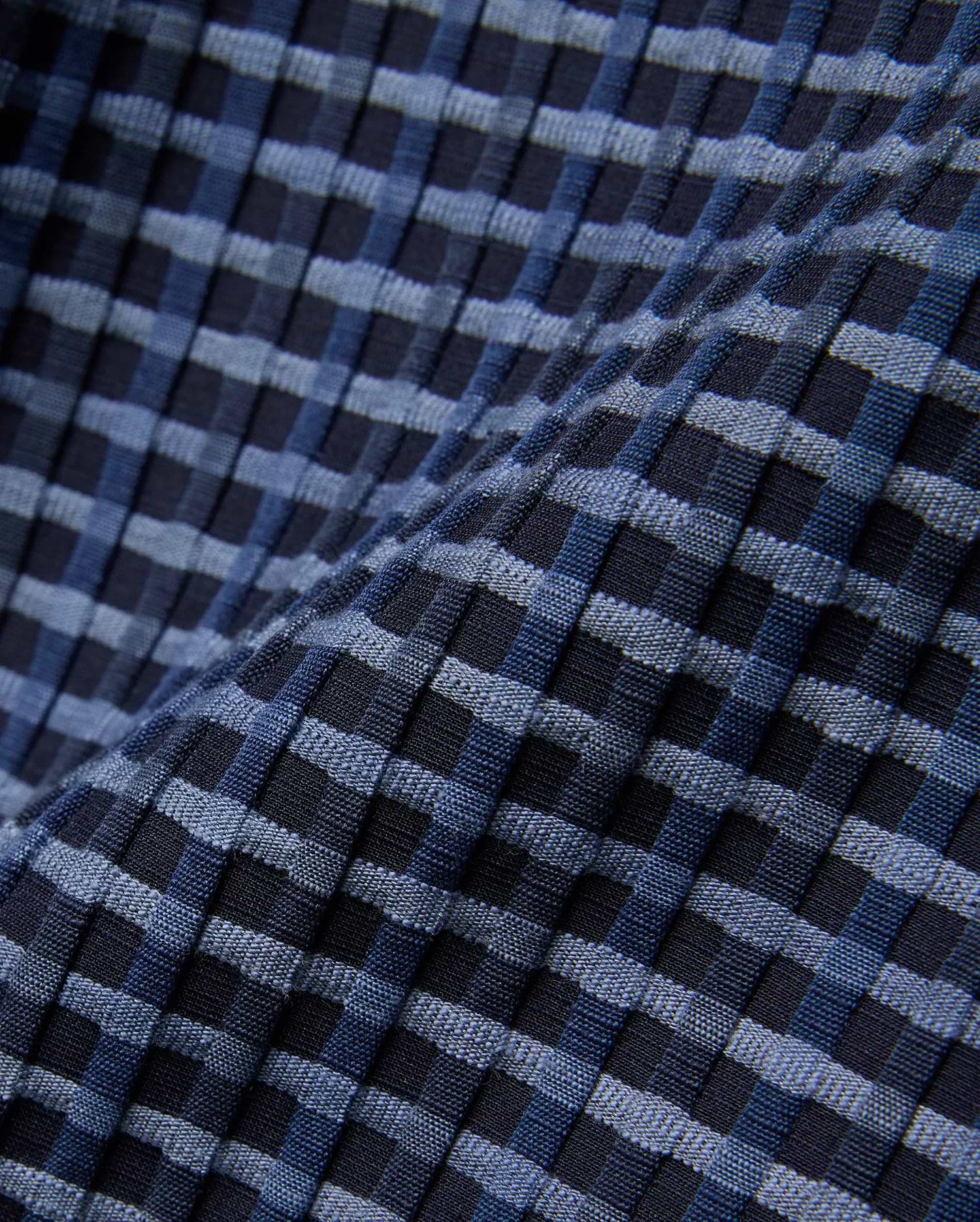 Mens Erik Raised Check Short featuring a textured, raised check pattern in varying shades of deep navy, medium blue, and light blue, creating a dynamic woven effect.