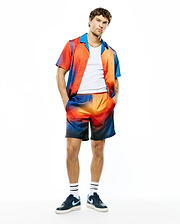 Relaxed fit gradient sunset jacquard short-sleeve shirt with blue collar and matching Mens Zander Jacquard Short, both featuring subtle all-over Psycho Bunny logo pattern, complemented by branded socks.