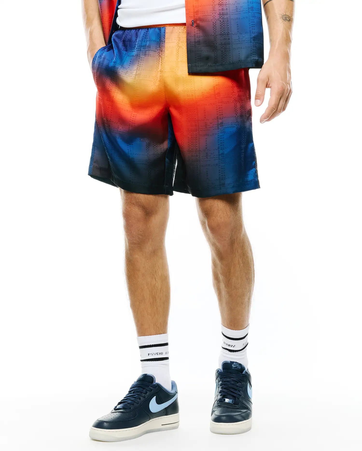 Mens Zander Jacquard Short, a relaxed fit short featuring a vibrant ombre gradient from deep blue to fiery orange, with a subtle woven grid pattern.