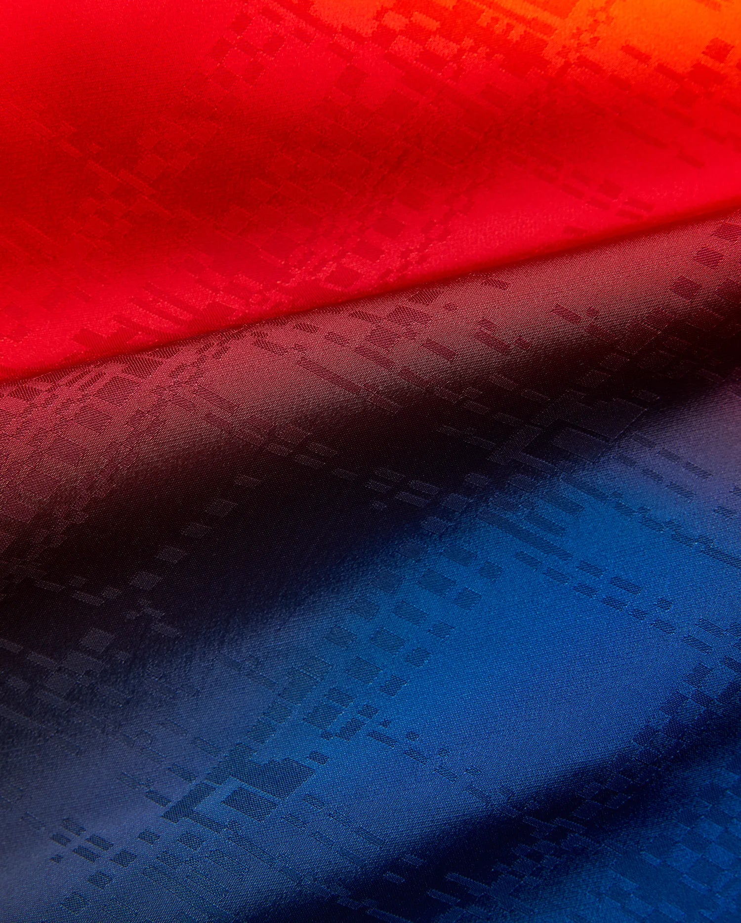 Mens Zander Jacquard Short in a striking red-to-deep-blue gradient, showcasing a refined, all-over tonal geometric jacquard pattern for a premium streetwear aesthetic.