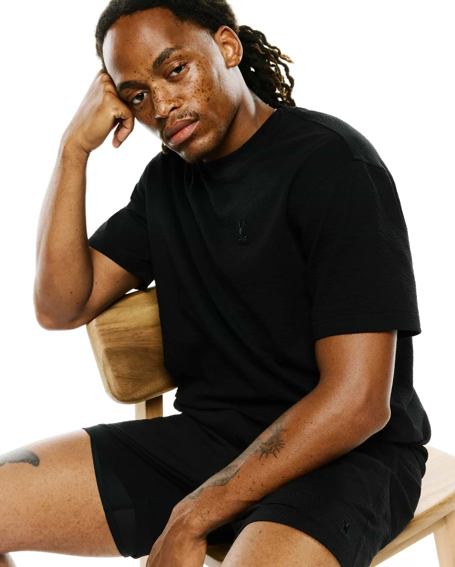 Black seersucker t-shirt, relaxed fit, with an embroidered bunny skull logo on the left chest, and matching Black Mens Arlen Seersucker Short with a bunny skull on the left thigh.