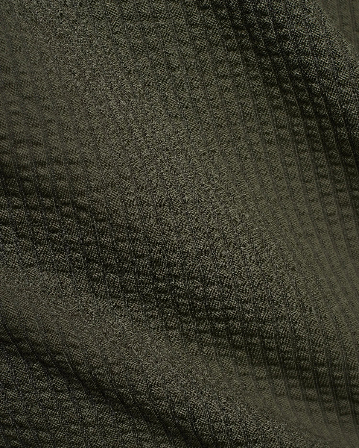 Psycho Bunny Mens Arlen Seersucker Short in dark olive green, featuring a classic seersucker fabric with a distinct puckered, vertically striped texture. (6)