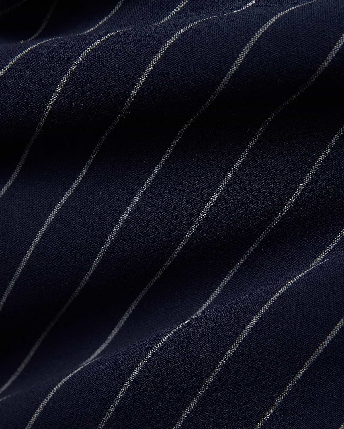 Mens Harland Double Weave Chalk Stripe Track Pant in deep navy blue, featuring fine, textured white chalk stripes woven into the fabric, highlighting its premium double weave texture. (6)