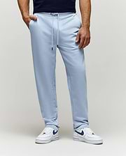 Mens Timothy 4k Bunny Jogger in light blue, crafted from soft french terry fabric with a relaxed fit, featuring a drawstring waist with black tips and convenient side pockets.