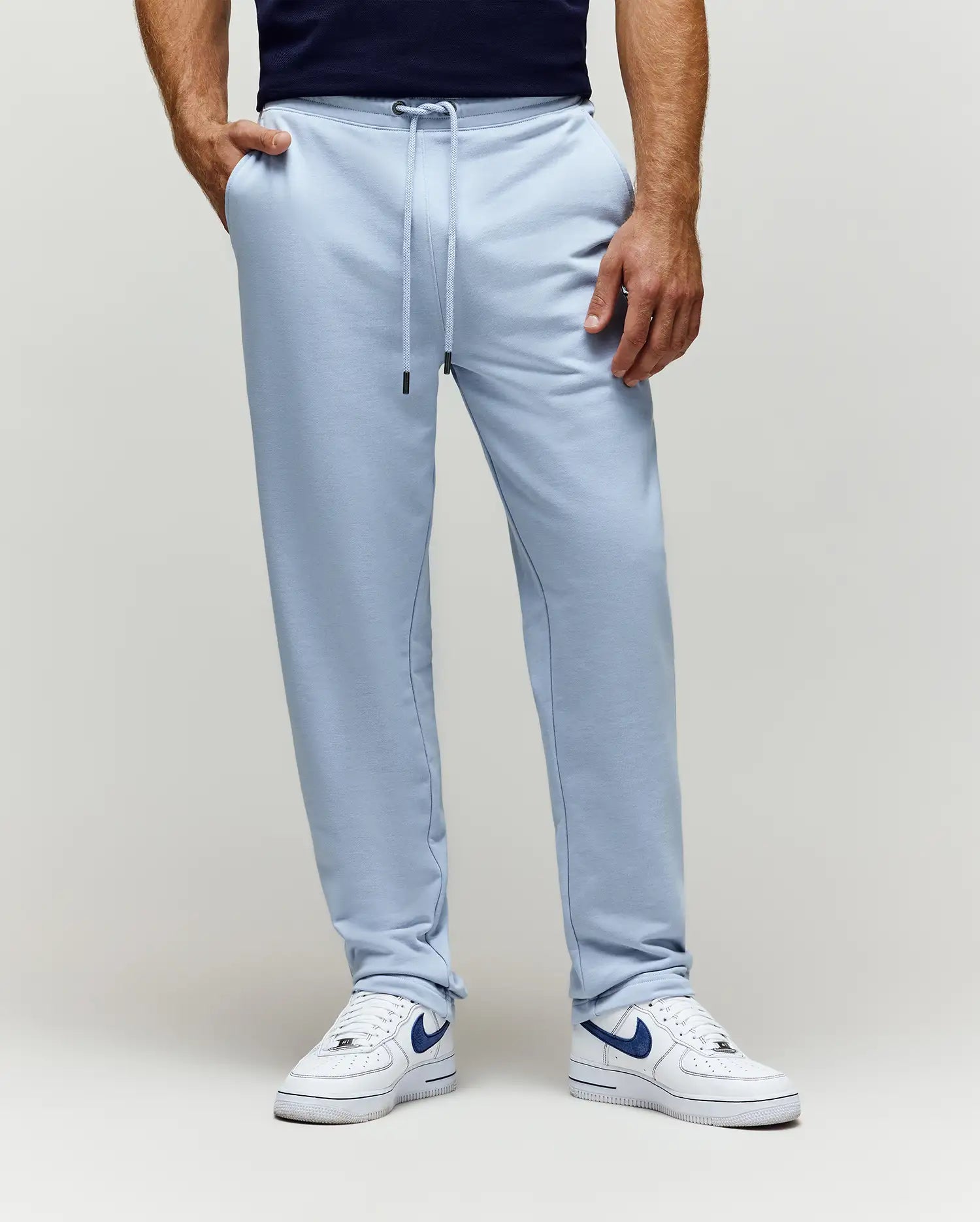 Mens Timothy 4k Bunny Jogger in light blue, crafted from soft french terry fabric with a relaxed fit, featuring a drawstring waist with black tips and convenient side pockets.