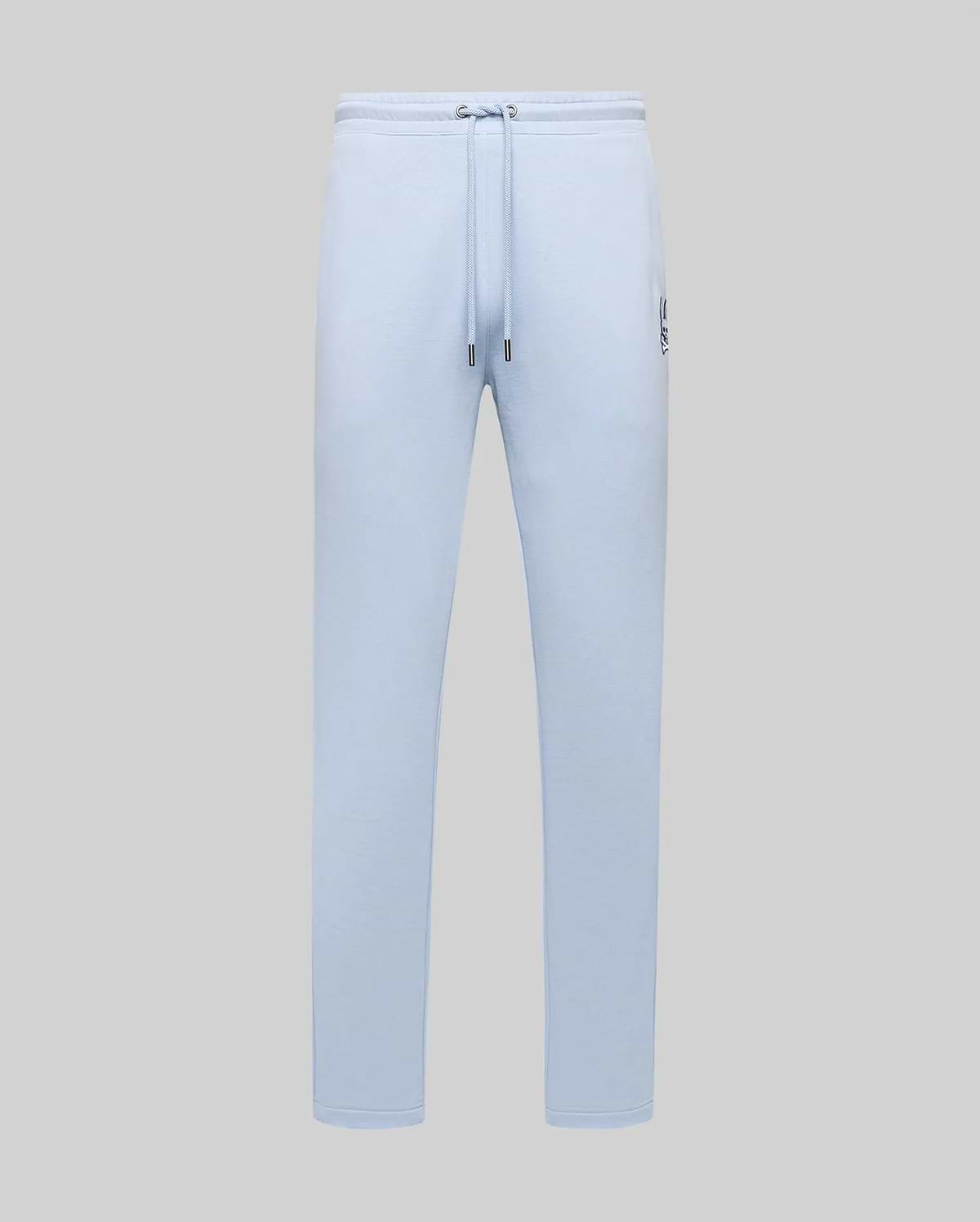 Light blue Mens Timothy 4k Bunny Jogger in a relaxed fit, featuring smooth jersey fabric, drawstring waist, and a small embroidered dark blue Psycho Bunny skull logo on the left thigh.