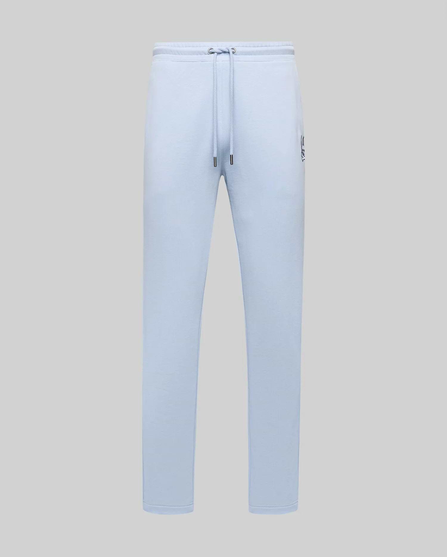 Light blue Mens Timothy 4k Bunny Jogger in a relaxed fit, featuring smooth jersey fabric, drawstring waist, and a small embroidered dark blue Psycho Bunny skull logo on the left thigh.
