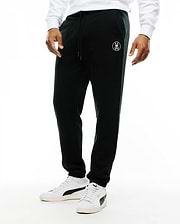 Mens Nathaniel Sweatpant, black relaxed fit french terry sweatpants with a drawstring waist, ribbed cuffs, and a small white embroidered Psycho Bunny skull logo on the left thigh.