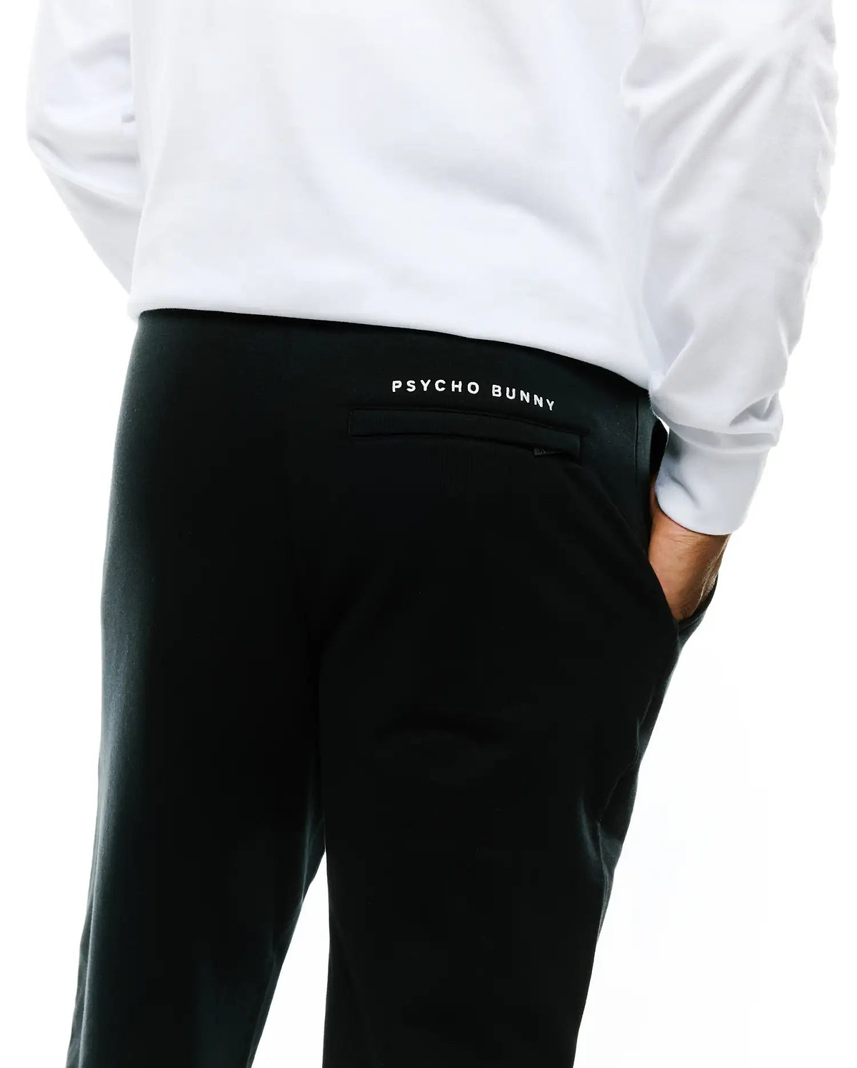 Mens Nathaniel Sweatpant, black relaxed fit French terry, featuring a small white embroidered Psycho Bunny text logo above the back right pocket.