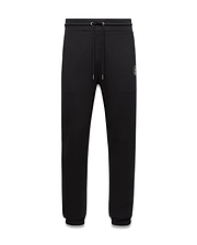Mens Nathaniel Sweatpant, black relaxed fit french terry sweatpants featuring a drawstring waist, ribbed cuffs, and a small embroidered white Psycho Bunny skull logo on the left thigh.