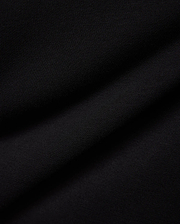 Mens Nathaniel Sweatpant in rich black, showcasing its luxurious, soft French terry knit fabric with a subtle diagonal texture and elegant drape, embodying premium streetwear style.