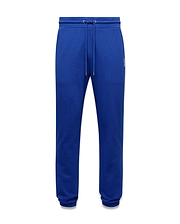 Mens Nathaniel Sweatpant in royal blue, featuring a classic fit, smooth jersey fabric, drawstring waist, ribbed cuffs, and a small white embroidered Psycho Bunny skull logo on the upper right thigh.