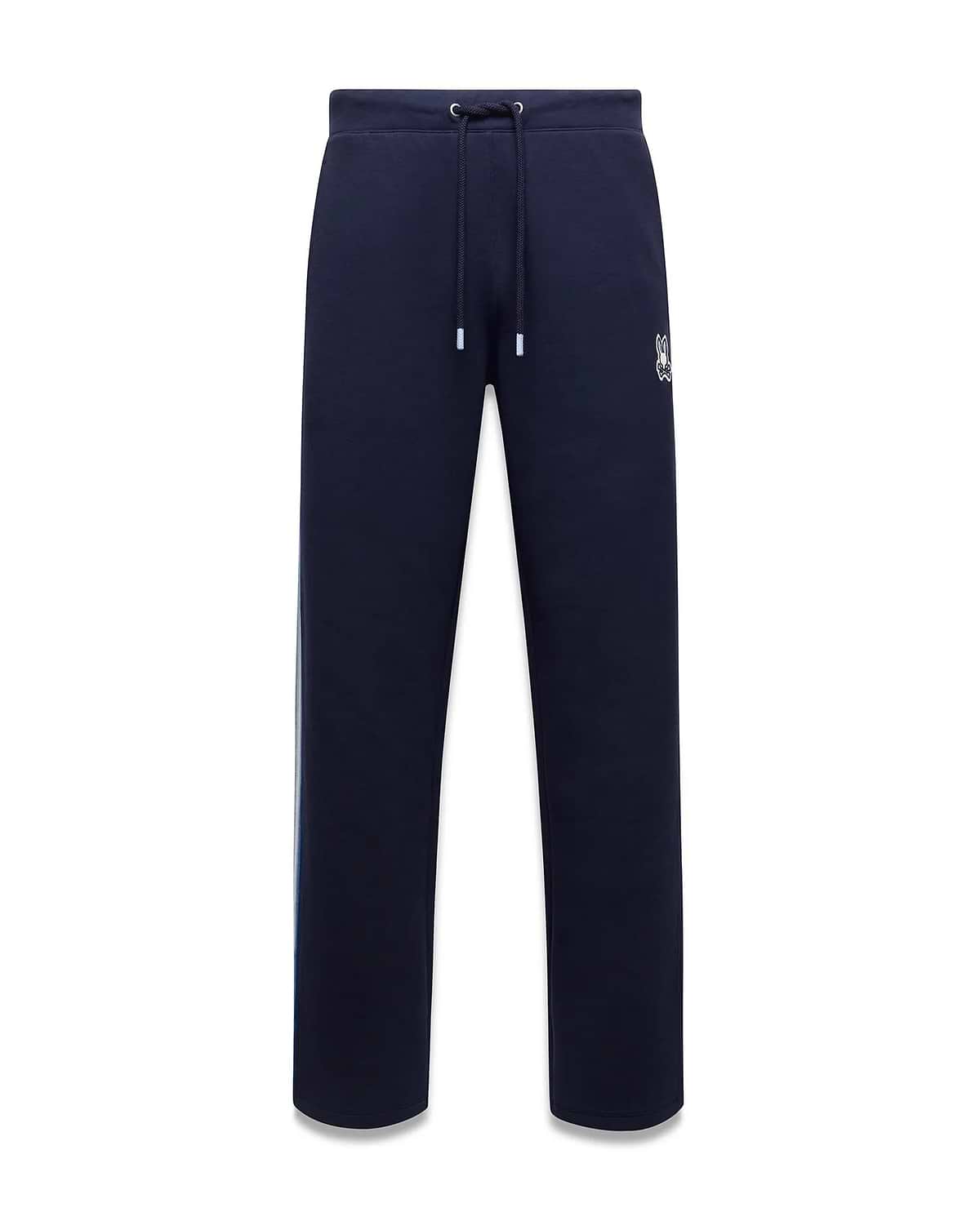 Mens Jaydon Track Pant, navy French terry with a relaxed fit, featuring a white drawstring waist, vertical blue and green side stripe, and a small embroidered white Psycho Bunny skull logo on the right thigh. (5)