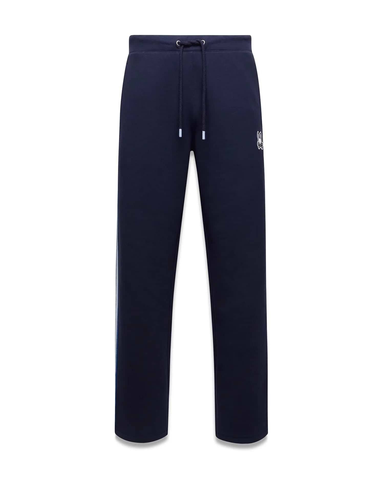 Mens Jaydon Track Pant, navy French terry with a relaxed fit, featuring a white drawstring waist, vertical blue and green side stripe, and a small embroidered white Psycho Bunny skull logo on the right thigh. (5)