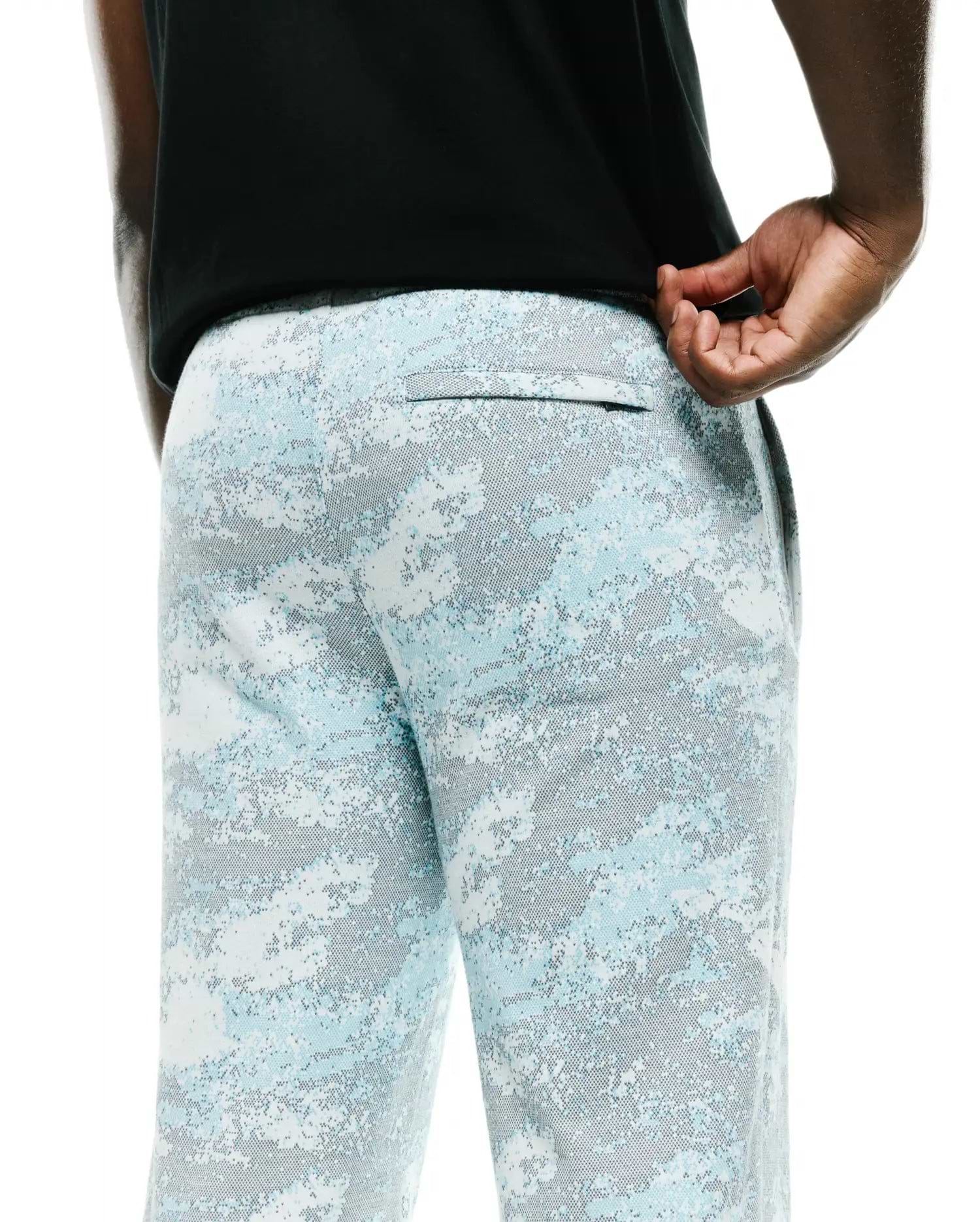 Men's Alfie Graphic Sweatpants, a relaxed fit pair in soft jersey fabric, showcasing a vibrant light blue, white, and grey digital camouflage pattern with a discreet back pocket. (3)