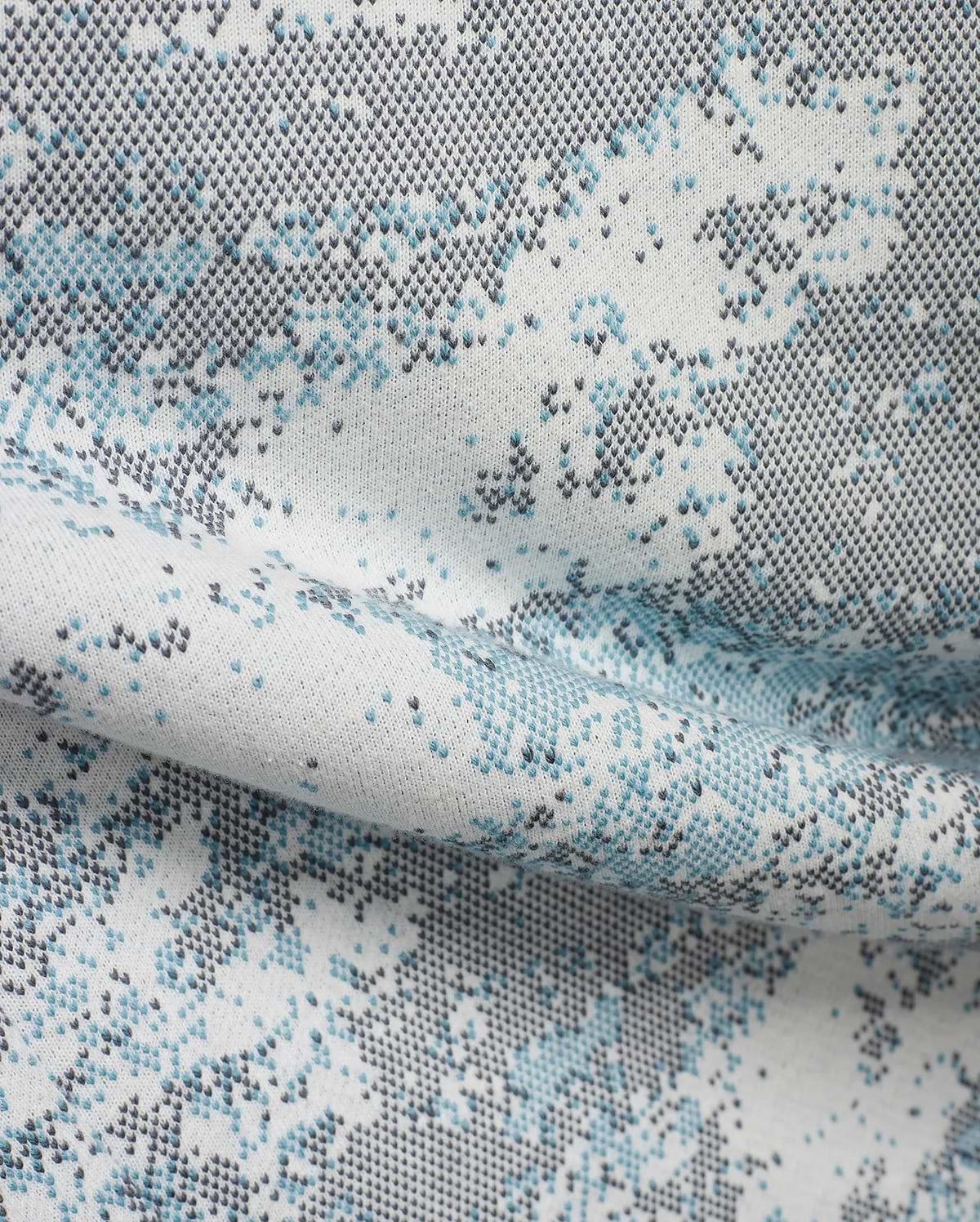 Men's Alfie Graphic Sweatpants in soft white knit, featuring a unique pixelated abstract pattern in vibrant light blue and dark grey, perfect for refined streetwear. (6)