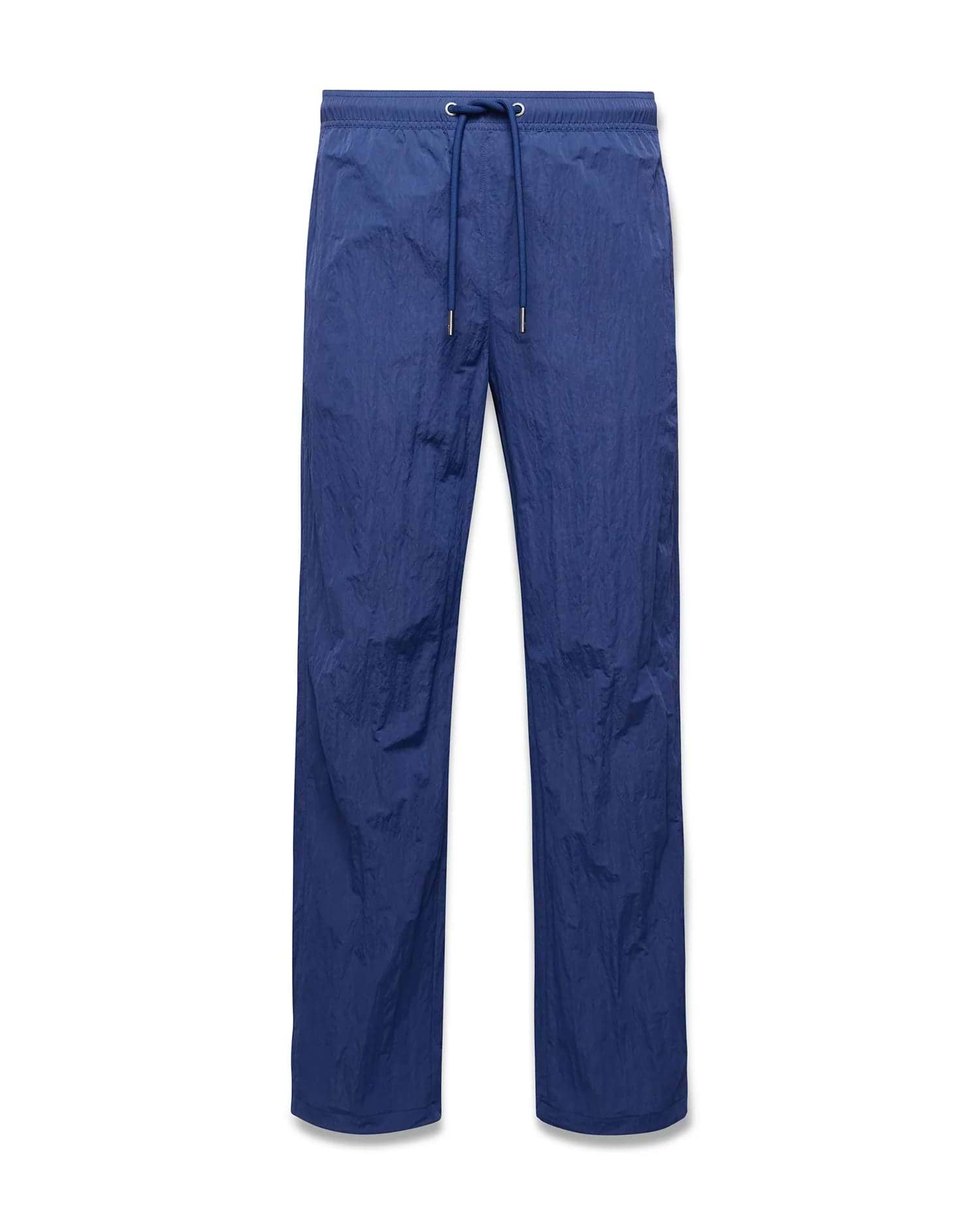 Mens Alder Nylon Pant in deep blue, featuring a relaxed straight leg fit, crinkled nylon fabric, and an elasticated drawstring waist with metallic tips. (5)