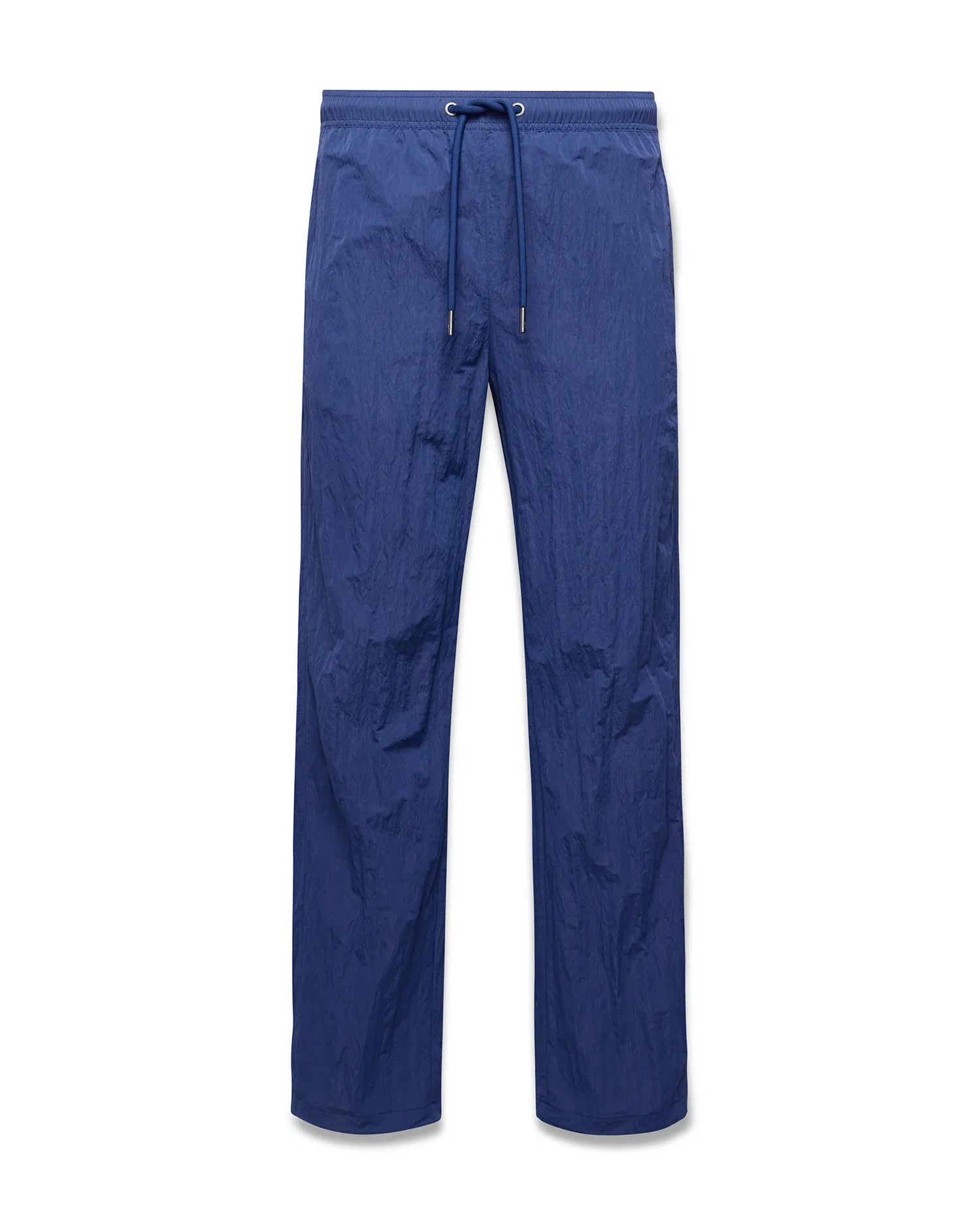 Mens Alder Nylon Pant in deep blue, featuring a relaxed straight leg fit, crinkled nylon fabric, and an elasticated drawstring waist with metallic tips. (5)