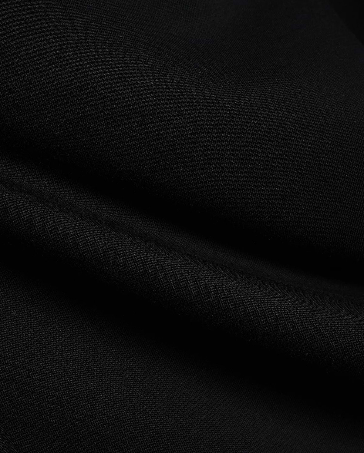 Black Mens Terrence Brushed Fleece Sweatpant fabric, showcasing the soft, luxurious texture of premium brushed fleece material with subtle, comfortable folds, ideal for refined streetwear.