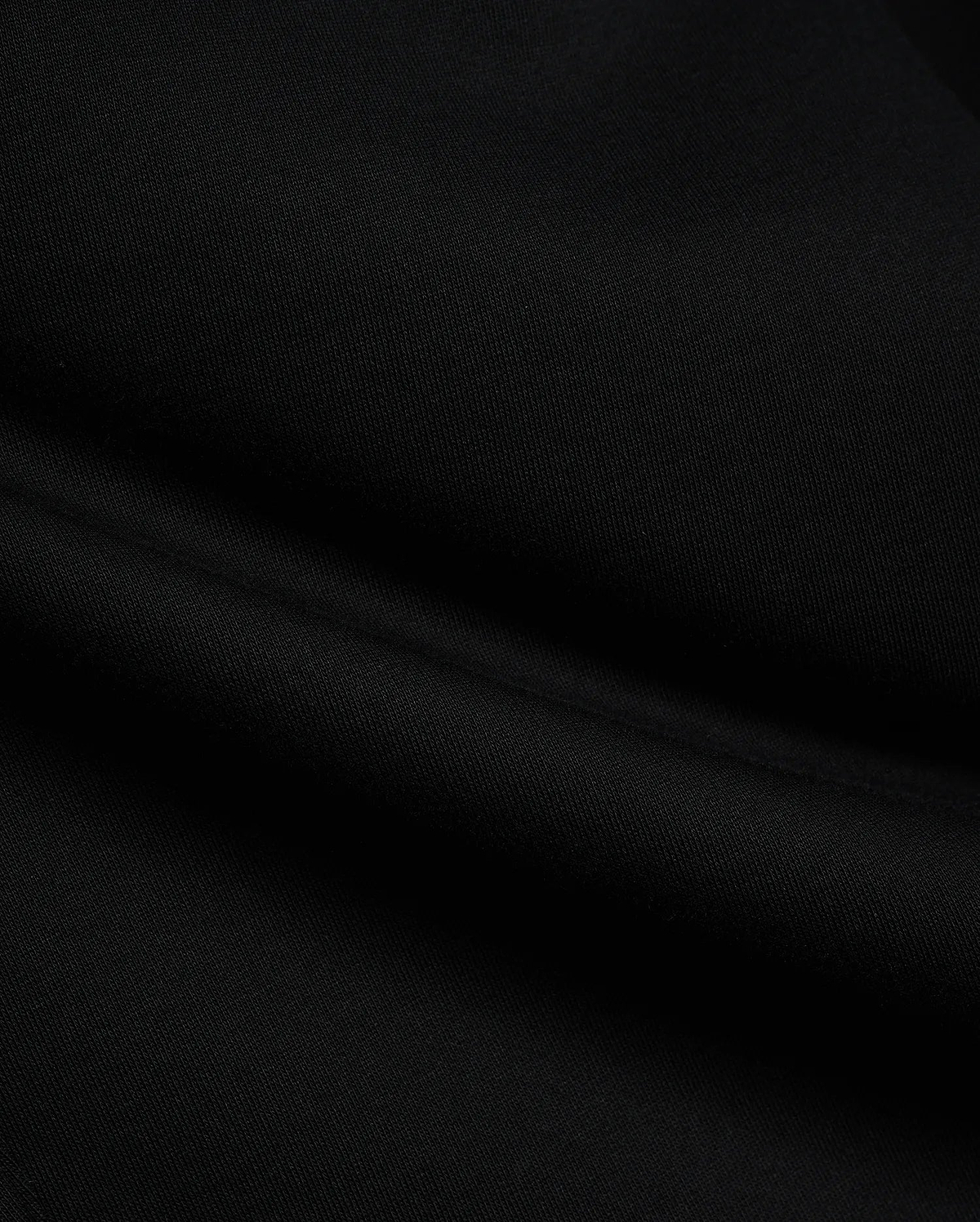 Black Mens Terrence Brushed Fleece Sweatpant fabric, showcasing the soft, luxurious texture of premium brushed fleece material with subtle, comfortable folds, ideal for refined streetwear.