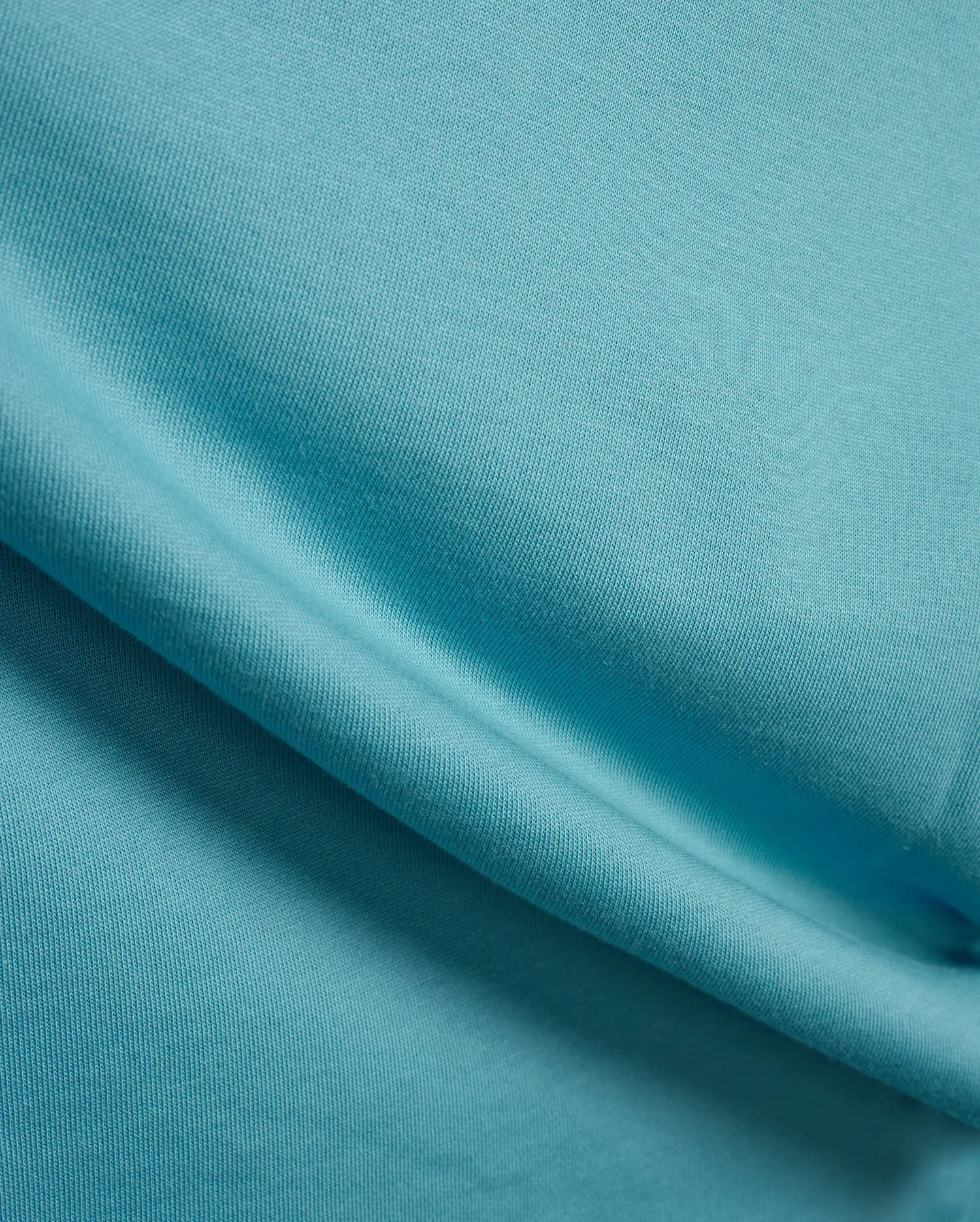 Mens Terrence Brushed Fleece Jogger in vibrant aqua blue, showcasing the soft, textured brushed fleece fabric with subtle diagonal knit detail. (6)