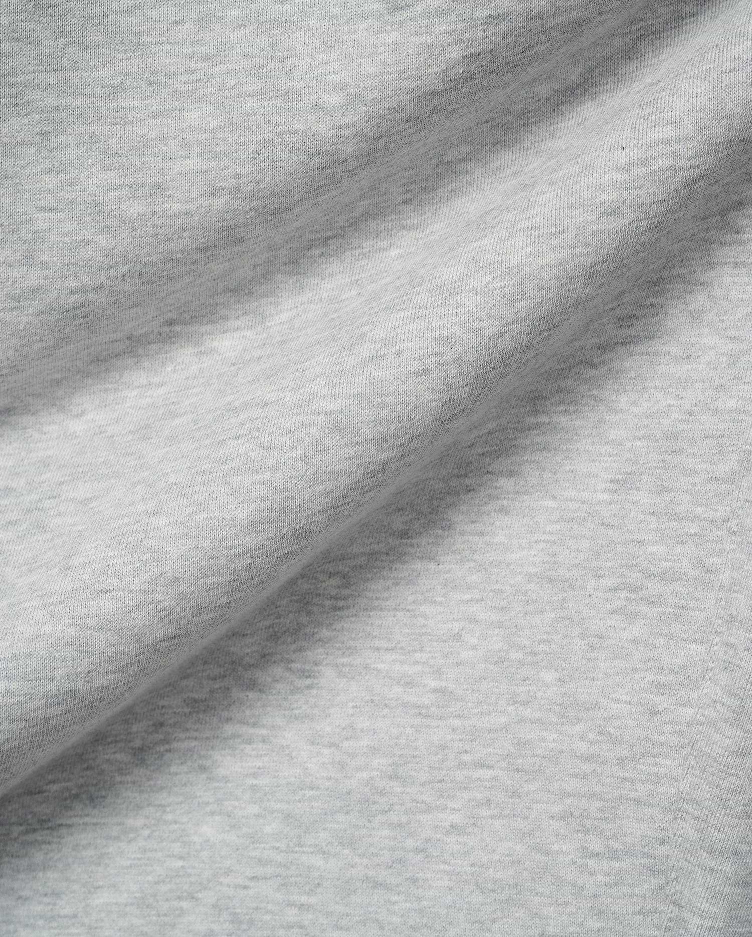 Mens Terrence Brushed Fleece Sweatpant, featuring a soft, light grey heathered brushed fleece fabric with a subtle knit texture and gentle folds.