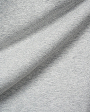 Mens Terrence Brushed Fleece Sweatpant, featuring a soft, light grey heathered brushed fleece fabric with a subtle knit texture and gentle folds.
