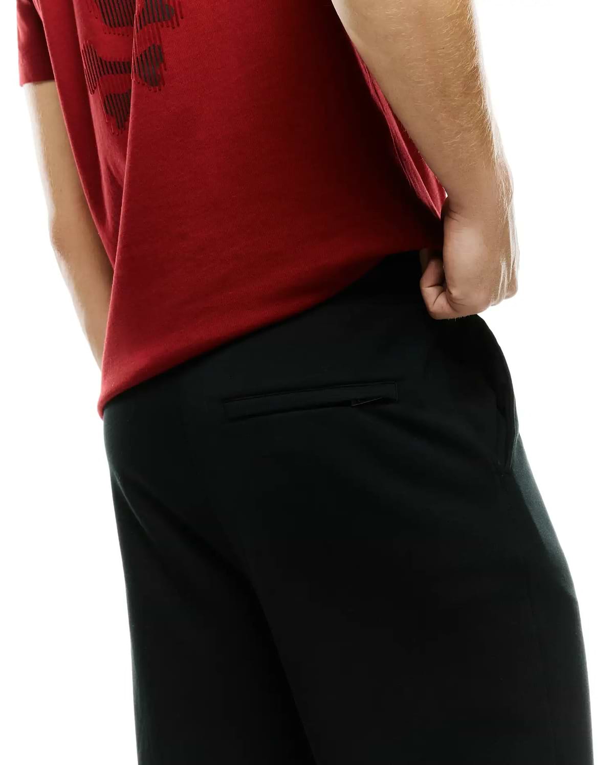 Men's Johan Straight-Leg Sweatpants in black, featuring a relaxed fit, smooth knit fabric, and a zippered back pocket, paired with a red jersey t-shirt with a dark graphic print. (3)